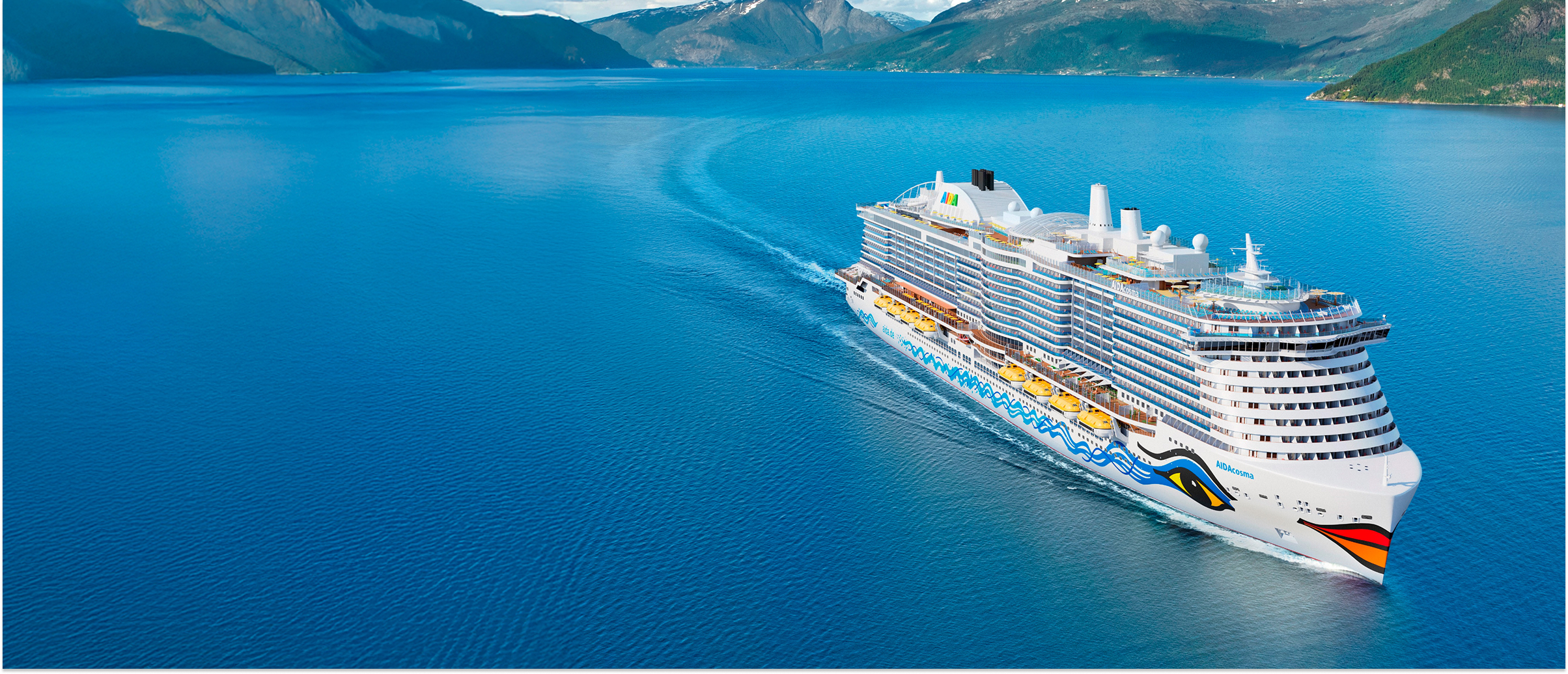 Aerial view of the AIDA Cosma cruise ship sailing in a mountain fjord