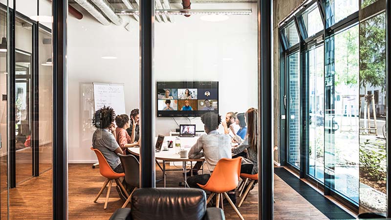 Team meeting in modern glass office