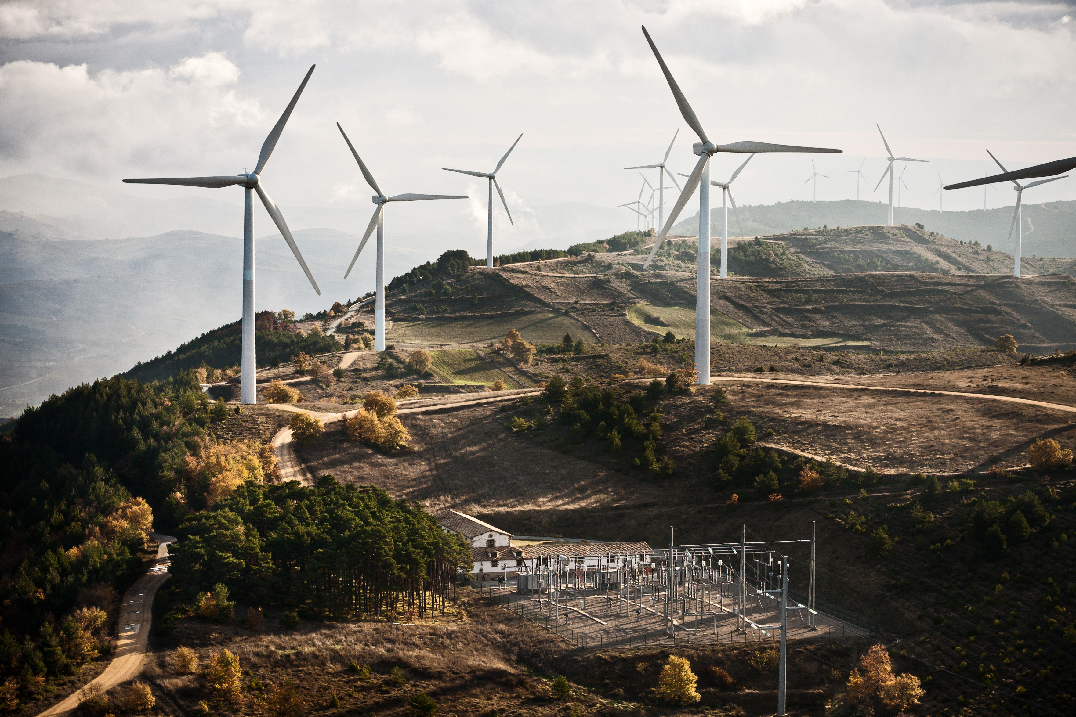 Wind turbines on a hill.