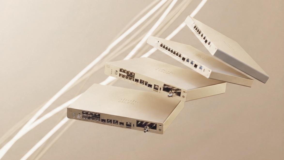 Four Cisco networking devices arranged in an expanded stack, displaying ports and the Cisco logo.