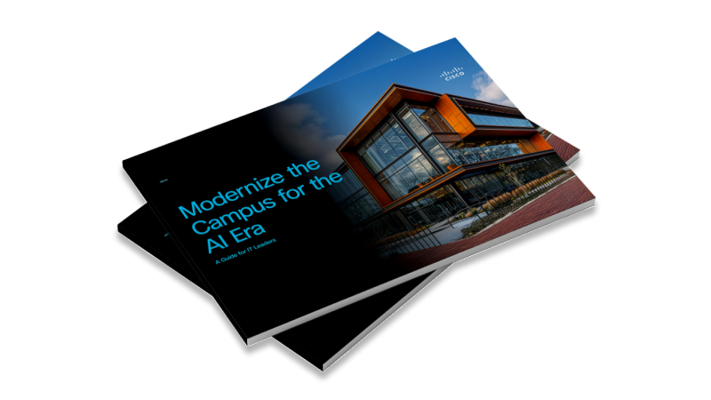 Two employes working at a desk on computers