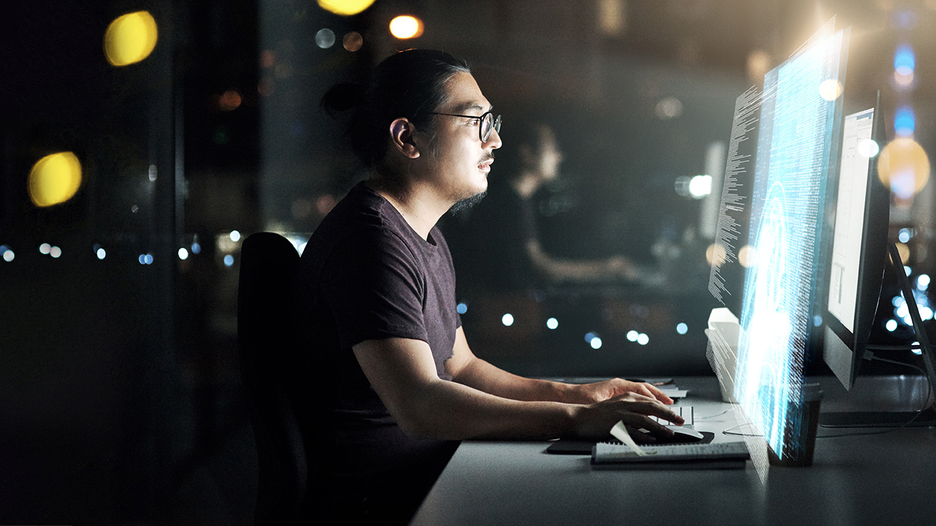 Cropped shot of a male computer programmer working late in the office on a new code