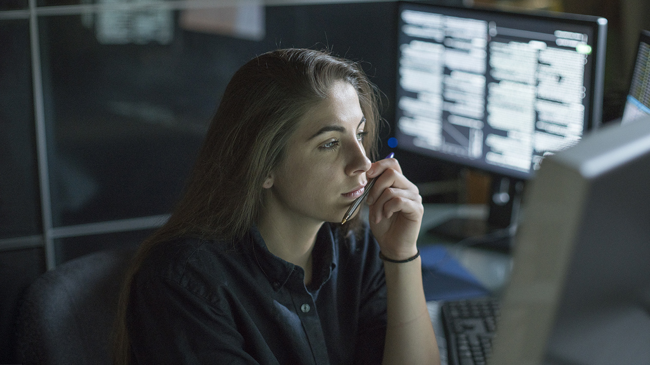 IT professional reviewing Intersight dashboards in computer lab